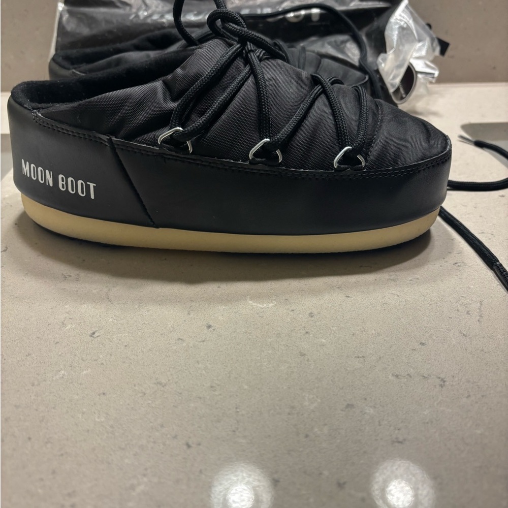 Moon Boot Womans Black Boots with White Rubber Soles